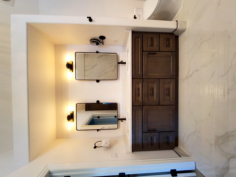 Master bathroom with double vanity and freestanding tub