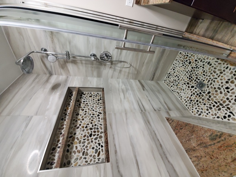 Walk-in shower with custom tile detail
