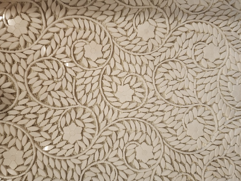 Detail of custom tile work in a bathroom remodel by Alpha Development Group